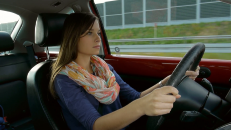 concentrated beautiful girl driving a car on a highway nkommbtgl F0011