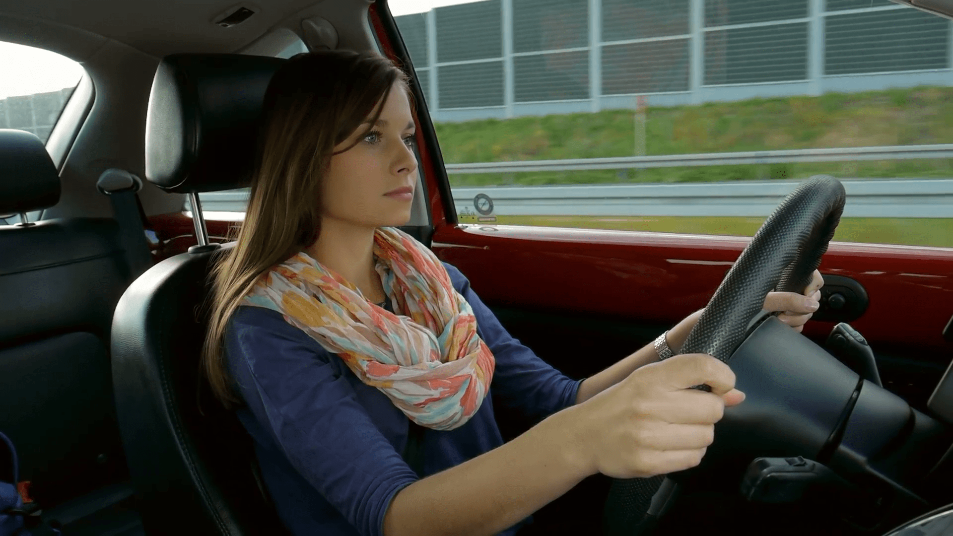 concentrated beautiful girl driving a car on a highway nkommbtgl  F0011